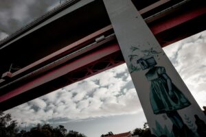 Graffiti on bridge column in town