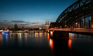 Stunning sunset in Cologne, Germany, illuminating the city's old town and iconic Cologne Cathedral